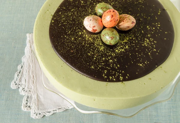 Easter cake with tea matcha decorated chocolate ganache and sweet-stuff eggs — Stock Photo, Image