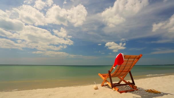 Sunlounger with Santa hat — Stock Video