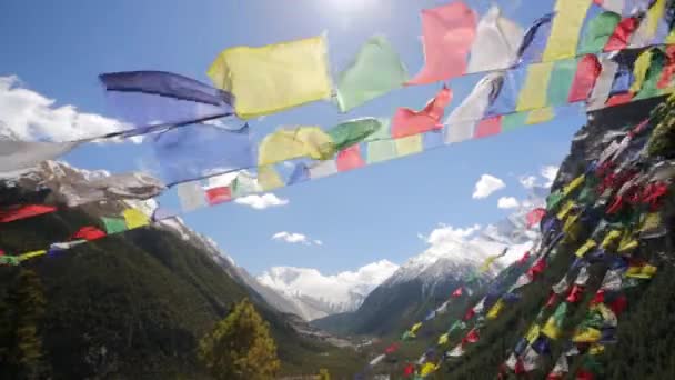 Prayer flags and snow Mountains — Stock Video