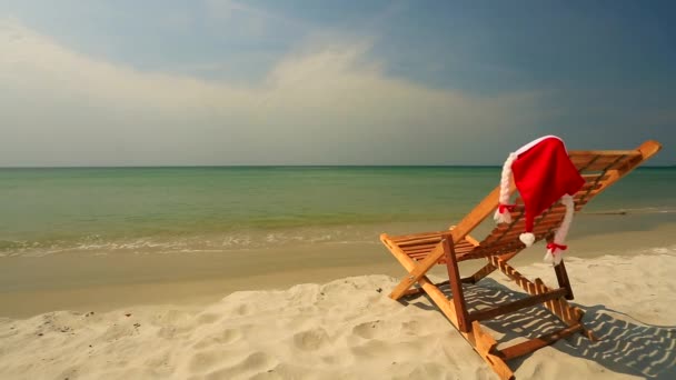 Sunlounger with Santa hat — Stock Video