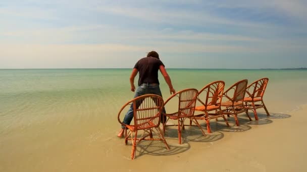 Man sits in chair — Stock Video