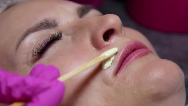 Beauty Salon Beautician Applies Melted Wax Model Upper Lip Remove — Stock Video