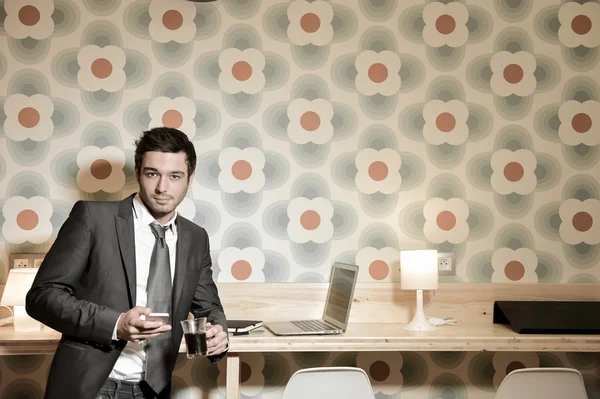 Handsome business man in restaurant talking on the phone — Stock Photo, Image