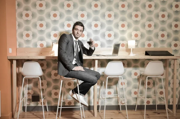 Handsome business man in restaurant talking on the phone — Stock Photo, Image