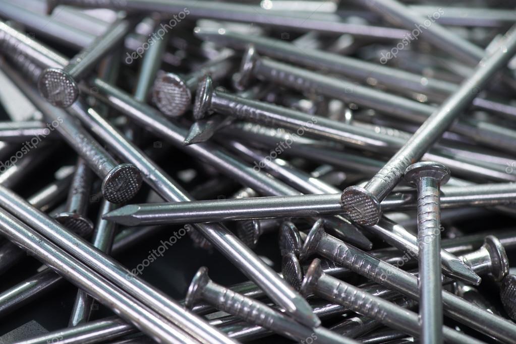 Carpenter long nails on a table Stock Photo by FreeProd 111710948