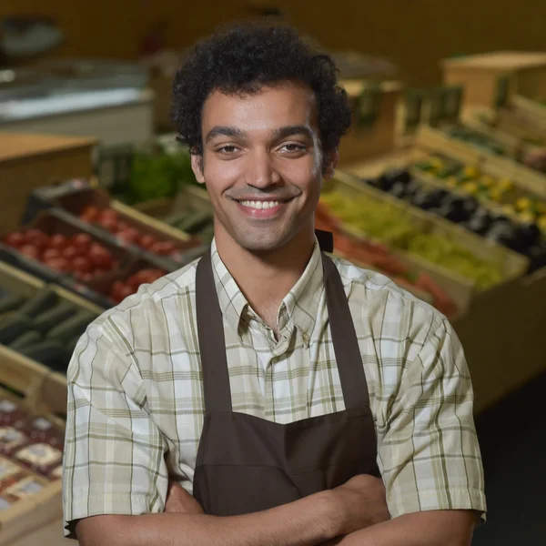 Portrait of Grocery clerk working in supermarket store — Stock Photo, Image