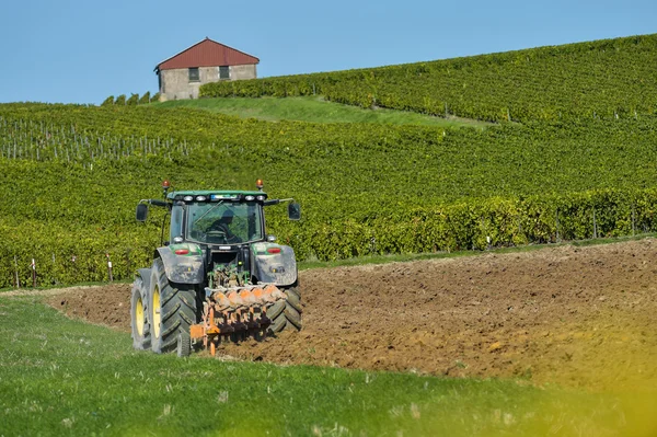 Tractor plowing the fields — Stock Photo, Image