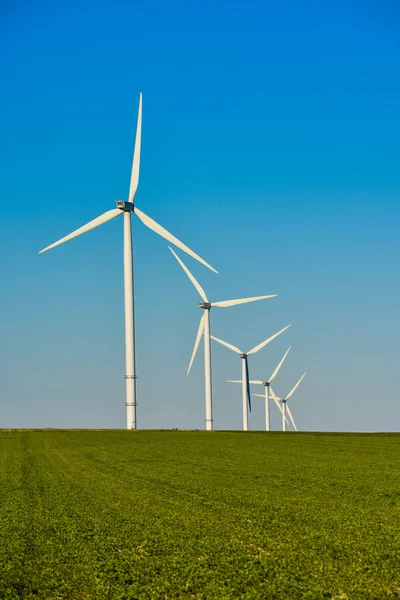 Windmills for electric power production on blue sky — Stock Photo, Image