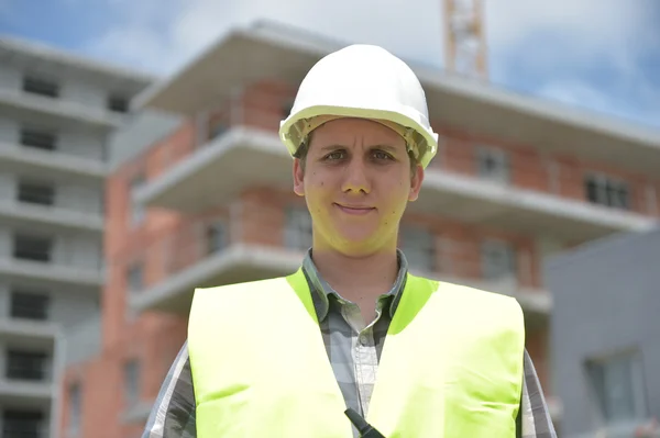 Construction manager checking building project on site — Stock Photo, Image