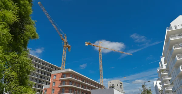 Building under construction and crane in France — Stock Photo, Image