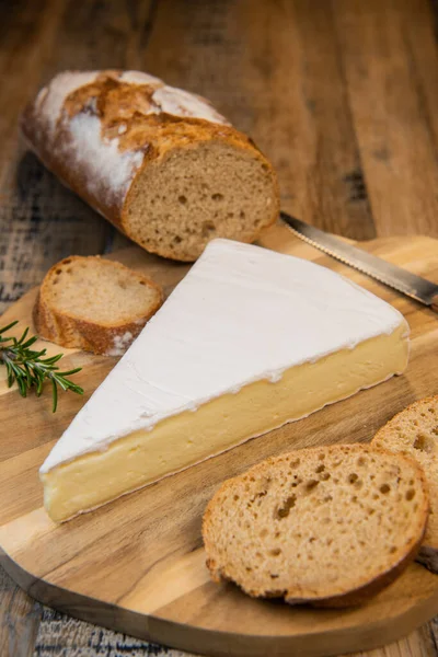 Brie cheese triangle with bread and parsley — Stock Photo, Image