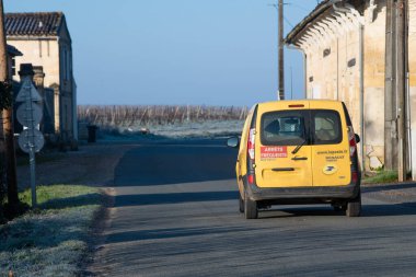 Gironde, Langoiran, France, January 11 2021, Yellow Kangoo Car of the French Post Service La Poste to Deliver the Mail  clipart