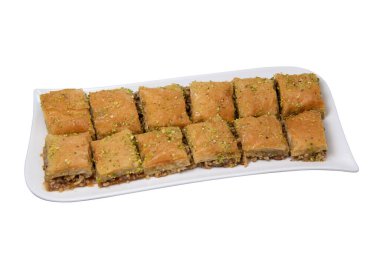 Baklawa bir tabakta, masanın üstünde, en üstte, baklava, ziyafet, ramazan geleneksel tatlısına
