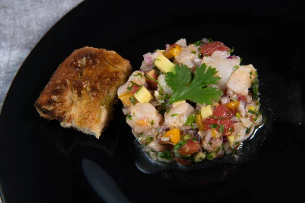 Cod Ceviche recipe, bread in oil and garlic. — Stock Photo, Image