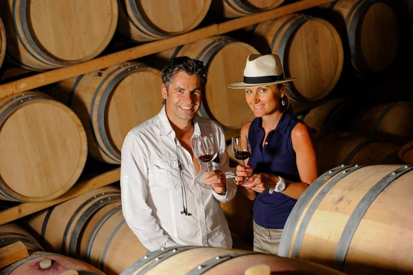 Tourism - Couple tasting wine in a cellar — Stock Photo, Image