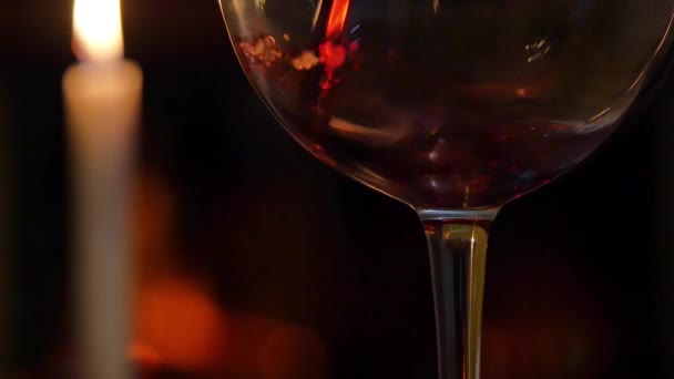 Red Wine glass in front of fireplace — Stock Video