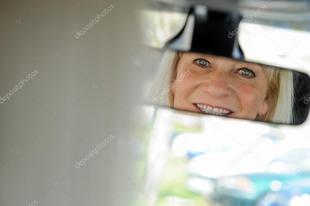 Senior At the Wheel looking in mirror