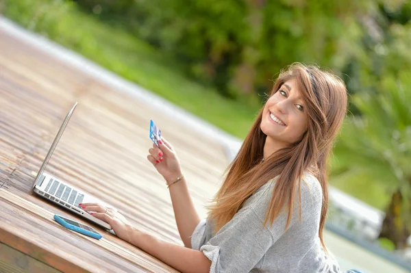 Young woman making purchases on Internet — Stock Photo, Image