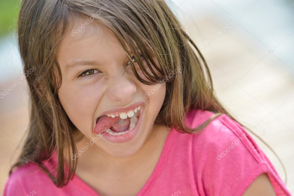Smiling Young Girl Tongue