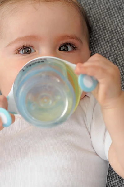 Small child - Baby drinking Royalty Free Stock Images