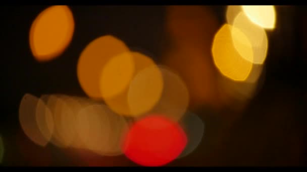 Defocused colorful city lights at night/ evening — Stock Video