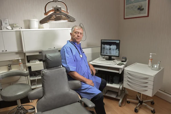 Dentist posing in his office — Stock Photo, Image