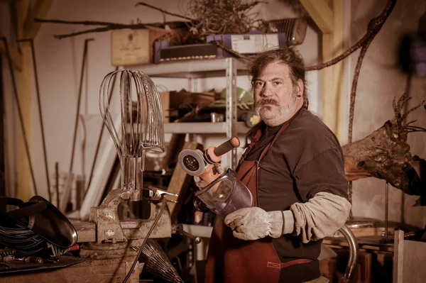 Metal worker standing in workshop — Stock Photo, Image