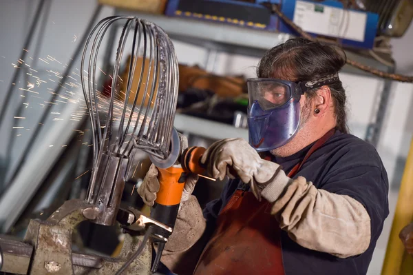 Metal worker Grinding with sparks in workshop — Stock Photo, Image