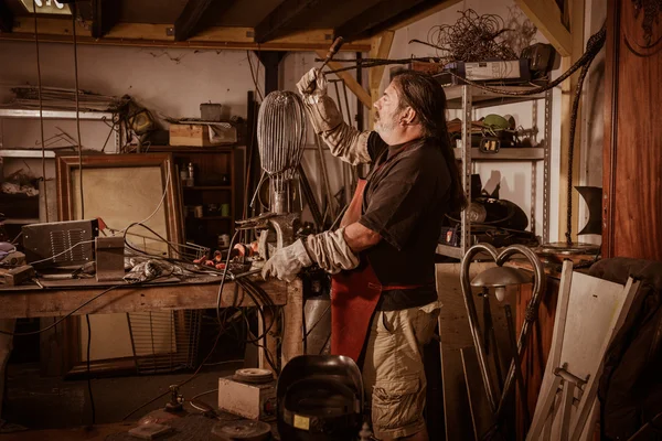 Metal worker standing in workshop — Stock Photo, Image