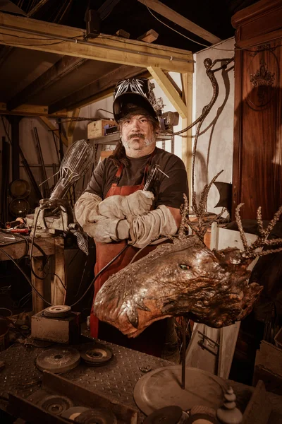 Metal worker standing in workshop — Stock Photo, Image