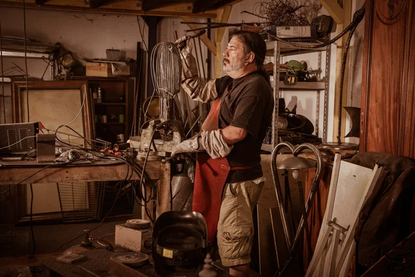 Metal worker standing in workshop — Stock Photo, Image