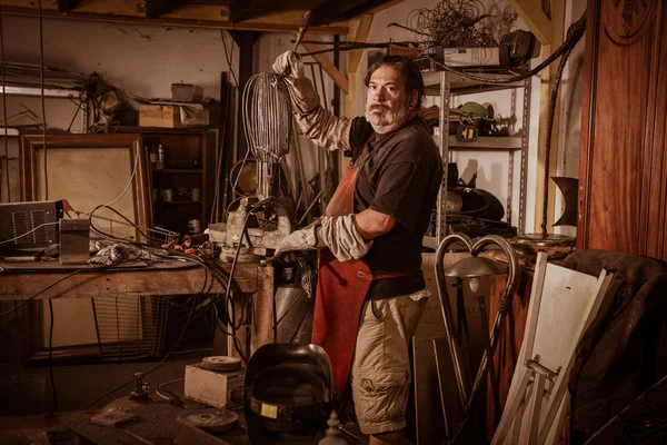 Metal worker standing in workshop — Stock Photo, Image