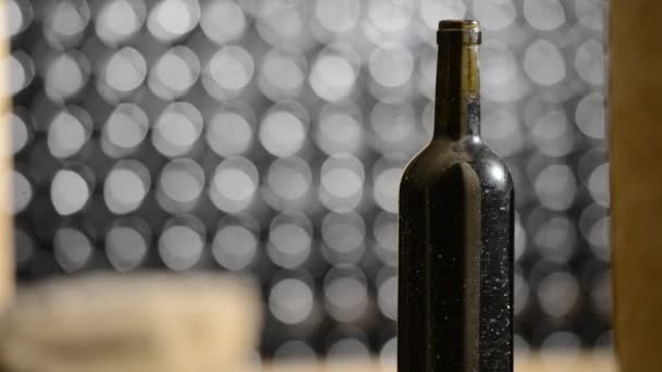 Bottle of red wine in an aging cellar.Close-up — Stock Video