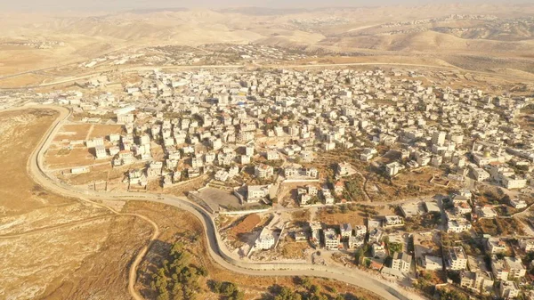 Israel and Palestine divided by Security wall Aerial viewAerial view of Left side Anata Palestinian town and Israeli neighbourhood Pisgat zeev