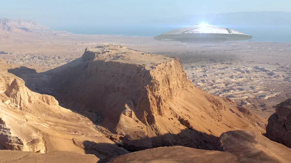 3d rendering,Alien Ufo Saucer over Ancient City in the desert- AerialDrone view over Masada close to dead sea in Israel,