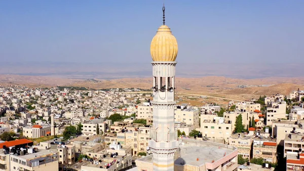 Mosque Tower minaret With Speakers in JerusalemBeautiful Drone footage with Jordan desert mountain, Shuafat, Jeusalem