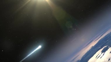 Göktaşı Dünya atmosferine giriyor. Göktaşının dünya mavi atmosferine girerken alevler içinde yanan gerçekçi görüntüsü.