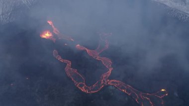 Lava Flows on active volcano aerial view, Mount Fagradalsfjall, Iceland4K drone shot from Iceland of Hot lava and magma coming out of the crater, April 2021 