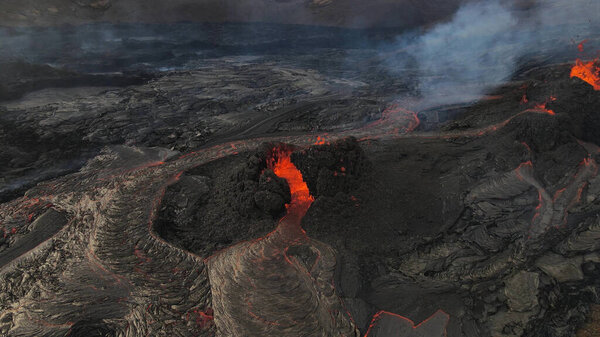 lava eruption volcano with snowy mountains, Aerial viewHot lava and magma coming out of the crater, April 2021 