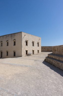 Interior view of the Castle of Santa Catalina in Cadiz, Andalusia, Spain. Ancient seaside fortress with stone walls and sunny courtyards, symbol of Spanish maritime and military history. Perfect image for concepts of tourism, heritage, architecture, 
