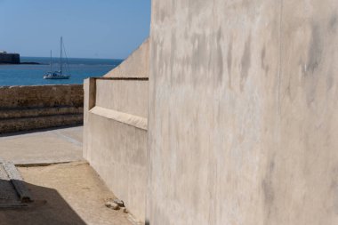 Interior view of the Castle of Santa Catalina in Cadiz, Andalusia, Spain. Ancient seaside fortress with stone walls and sunny courtyards, symbol of Spanish maritime and military history. Perfect image for concepts of tourism, heritage, architecture, 