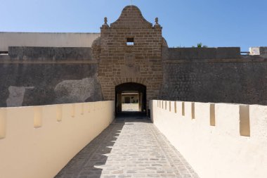 Interior view of the Castle of Santa Catalina in Cadiz, Andalusia, Spain. Ancient seaside fortress with stone walls and sunny courtyards, symbol of Spanish maritime and military history. Perfect image for concepts of tourism, heritage, architecture, 