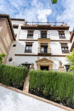 Details of the traditional architecture of Granada, southern Spain. Colorful facades, decorated balconies, and Moorish style reflect the Andalusian and Arabic influence of the city. Perfect image for travel, culture, history,