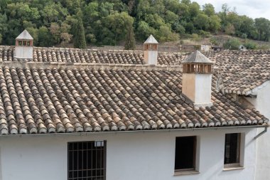 Details of the traditional architecture of Granada, southern Spain. Colorful facades, decorated balconies, and Moorish style reflect the Andalusian and Arabic influence of the city. Perfect image for travel, culture, history