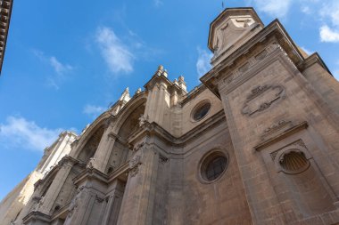 View of the majestic Cathedral of Granada, located in the heart of the Andalusian city. A remarkable example of Spanish Renaissance architecture with Baroque details. Perfect image for concepts of faith, history, art, religion, and cultural tourism 