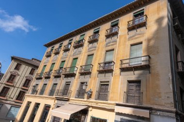 Details of the traditional architecture of Granada, southern Spain. Colorful facades, decorated balconies, and Moorish style reflect the Andalusian and Arabic influence of the city. Perfect image for travel, culture, history, 