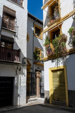 Details of the traditional architecture of Granada, southern Spain. Colorful facades, decorated balconies, and Moorish style reflect the Andalusian and Arabic influence of the city. Perfect image for travel, culture, history, and tourism concepts in 