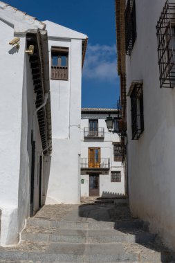 Details of the traditional architecture of Granada, southern Spain. Colorful facades, decorated balconies, and Moorish style reflect the Andalusian and Arabic influence of the city. Perfect image for travel, culture, history, and tourism concepts in 