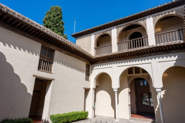 Exterior view of the Palacio de Dar al-Horra in Granada, Spain, a historic Nasrid-era palace featuring Moorish architecture. Perfect image for concepts of history, culture, architecture, and Andalusian tourism.