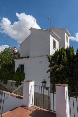 Interior view of a typical patio in Granada, featuring a central courtyard, plants, fountains, and Andalusian architecture. Perfect image for concepts of culture, architecture, tourism, history, and traditional Spanish life.